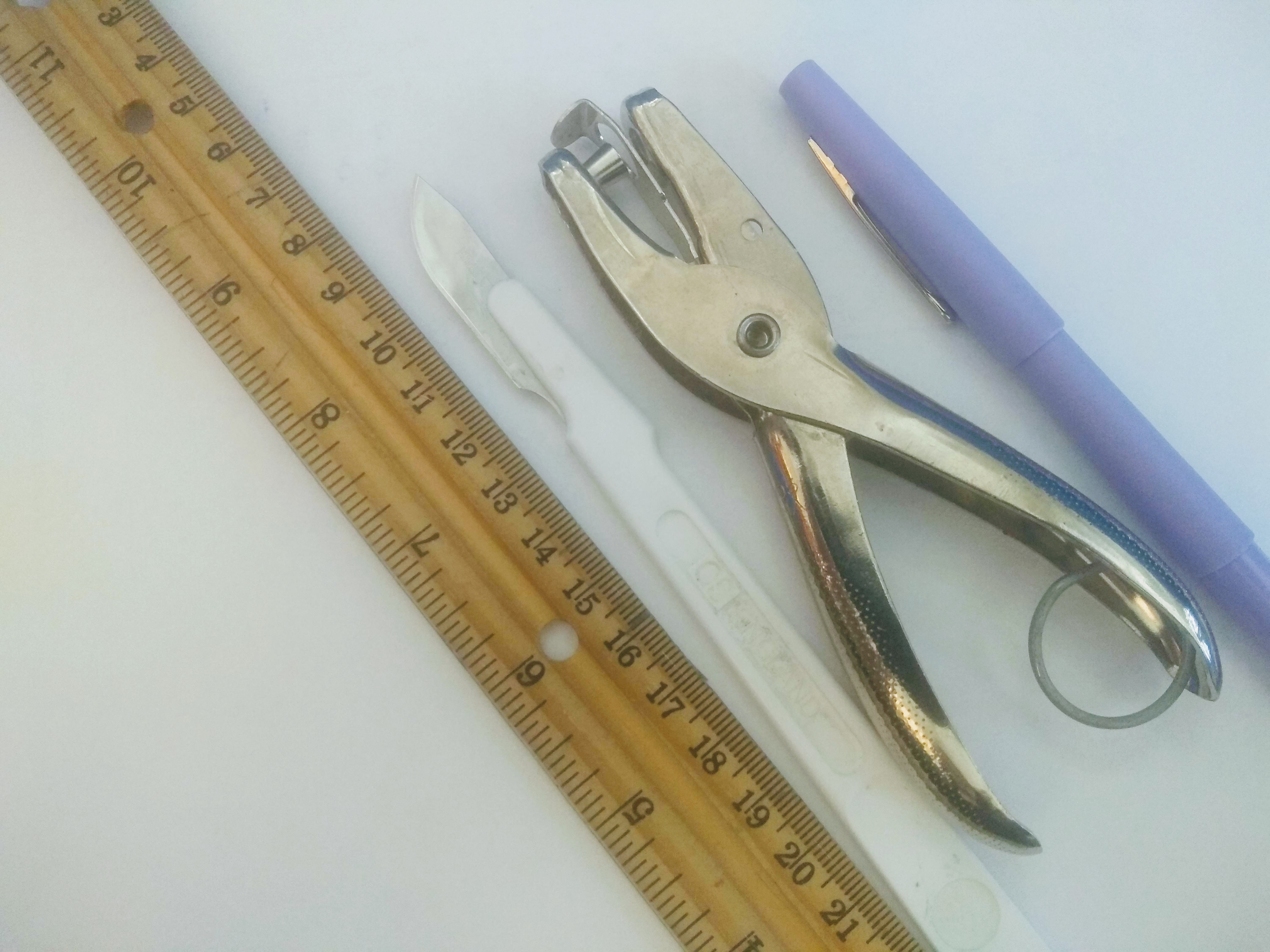 Hole punch answer key sheet grading ruler scalpel pen